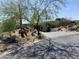 Inviting exterior view of a home featuring desert landscaping and a stone-paved driveway leading to the entrance at 10336 E Chia Way, Scottsdale, AZ 85262