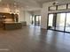 Bright, open-concept living room with wood flooring and large sliding doors to the pool at 10336 E Chia Way, Scottsdale, AZ 85262