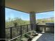 Outdoor kitchen with stone pillar and desert views, perfect for entertaining guests at 10336 E Chia Way, Scottsdale, AZ 85262