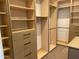 Well-organized walk-in closet with custom shelving, drawers, and ample storage space at 10336 E Chia Way, Scottsdale, AZ 85262