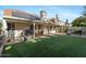Backyard oasis with covered patio, artificial turf and solar panels at 2235 E Lakecrest Dr, Gilbert, AZ 85234