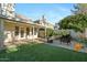 Relaxing backyard with covered patio, artificial turf, and seating area at 2235 E Lakecrest Dr, Gilbert, AZ 85234