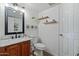 Updated bathroom with wood vanity and modern fixtures at 2235 E Lakecrest Dr, Gilbert, AZ 85234