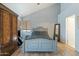Bright bedroom with vaulted ceiling, wood flooring, and large wardrobe at 2235 E Lakecrest Dr, Gilbert, AZ 85234