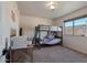 Cozy bedroom with a bunk bed and plenty of floor space at 2235 E Lakecrest Dr, Gilbert, AZ 85234