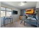 Bedroom with a bunk bed, window, and wall-mounted TV at 2235 E Lakecrest Dr, Gilbert, AZ 85234