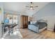 Spacious bedroom with vaulted ceiling, wood flooring, and private access to backyard at 2235 E Lakecrest Dr, Gilbert, AZ 85234