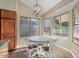 Bright breakfast nook with wood floors and a view of the backyard at 2235 E Lakecrest Dr, Gilbert, AZ 85234