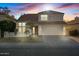 Two-story house with tile roof, attached garage, and landscaping at 2235 E Lakecrest Dr, Gilbert, AZ 85234