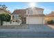 Two-story house with tile roof, attached garage, and landscaping at 2235 E Lakecrest Dr, Gilbert, AZ 85234