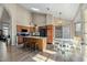 Kitchen features an island, wood cabinets, and a breakfast nook at 2235 E Lakecrest Dr, Gilbert, AZ 85234