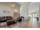 Open living room with hardwood floors and access to kitchen at 2235 E Lakecrest Dr, Gilbert, AZ 85234