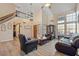 Bright living room featuring hardwood floors and a view of the staircase at 2235 E Lakecrest Dr, Gilbert, AZ 85234