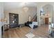 Elegant living room with high ceilings, hardwood floors, and a fireplace at 2235 E Lakecrest Dr, Gilbert, AZ 85234