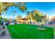 Landscaped backyard with lush lawn and pool at 2534 S Grandview Ave, Tempe, AZ 85282