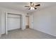 Bright bedroom with carpeted floor, closet, and ceiling fan at 2534 S Grandview Ave, Tempe, AZ 85282