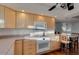 Kitchen with light wood cabinets and built-in microwave at 2534 S Grandview Ave, Tempe, AZ 85282