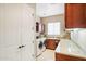 Bright laundry room with washer, dryer, and ample counter space at 28728 N 129Th Ln, Peoria, AZ 85383