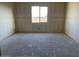 Spacious bedroom with a large window providing natural light and a serene view at 7631 W Tether Trl, Peoria, AZ 85383