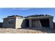 New home construction showing stucco exterior and roof tiles awaiting installation on a sunny day at 7631 W Tether Trl, Peoria, AZ 85383