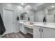 Modern bathroom with double vanity and a large mirror at 1078 S 151St Ln, Goodyear, AZ 85338