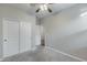 Bedroom with double door closet and carpeted floor at 1078 S 151St Ln, Goodyear, AZ 85338