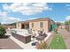 Private backyard with a pool, fire pit, and patio furniture at 12866 S 183Rd Ave, Goodyear, AZ 85338