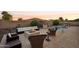 Tranquil backyard with a fire pit and comfortable seating at 12866 S 183Rd Ave, Goodyear, AZ 85338