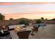 Outdoor living space with pool, fire pit, and seating at 12866 S 183Rd Ave, Goodyear, AZ 85338