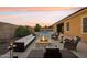 Relaxing backyard with pool, fire pit, and seating area at 12866 S 183Rd Ave, Goodyear, AZ 85338