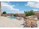 Pool and patio area with outdoor kitchen and seating at 12866 S 183Rd Ave, Goodyear, AZ 85338