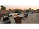 Outdoor living space with pool, fire pit, and seating at 12866 S 183Rd Ave, Goodyear, AZ 85338