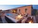Relaxing backyard with fire pit and pool at 12866 S 183Rd Ave, Goodyear, AZ 85338