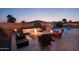 Relaxing backyard with fire pit and pool at 12866 S 183Rd Ave, Goodyear, AZ 85338