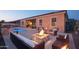Relaxing backyard with fire pit and pool at 12866 S 183Rd Ave, Goodyear, AZ 85338