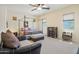 Main bedroom with a four poster bed and sitting area at 12866 S 183Rd Ave, Goodyear, AZ 85338