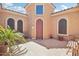 Private courtyard entry with brick pavers and seating at 12866 S 183Rd Ave, Goodyear, AZ 85338