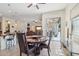 Charming dining room with a round table and access to the backyard at 12866 S 183Rd Ave, Goodyear, AZ 85338