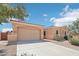 Single-story home with desert landscaping and two-car garage at 12866 S 183Rd Ave, Goodyear, AZ 85338