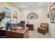 Bright home office features built-in shelving and large windows at 12866 S 183Rd Ave, Goodyear, AZ 85338