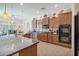 Modern kitchen with a large island and lots of storage at 12866 S 183Rd Ave, Goodyear, AZ 85338