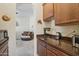 Kitchen features dark countertops and ample cabinet space at 12866 S 183Rd Ave, Goodyear, AZ 85338