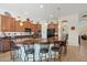 Modern kitchen with an island, ample counter space, and wooden cabinetry at 12866 S 183Rd Ave, Goodyear, AZ 85338