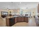 Open kitchen with large island and stainless steel appliances at 12866 S 183Rd Ave, Goodyear, AZ 85338