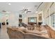 Spacious living room with a cozy fireplace and large sectional sofa at 12866 S 183Rd Ave, Goodyear, AZ 85338