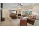 Open living room with a fireplace and comfortable seating area at 12866 S 183Rd Ave, Goodyear, AZ 85338