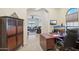 Home office with built-in desk and view into living area at 12866 S 183Rd Ave, Goodyear, AZ 85338