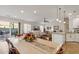 Bright dining area with light wood table and access to the kitchen at 1610 W Jasper Dr, Chandler, AZ 85224