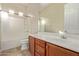 Clean bathroom with a shower/tub combo and wood vanity at 21438 S 194Th St, Queen Creek, AZ 85142