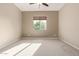 Bright bedroom with carpeted floors and a large window at 21438 S 194Th St, Queen Creek, AZ 85142